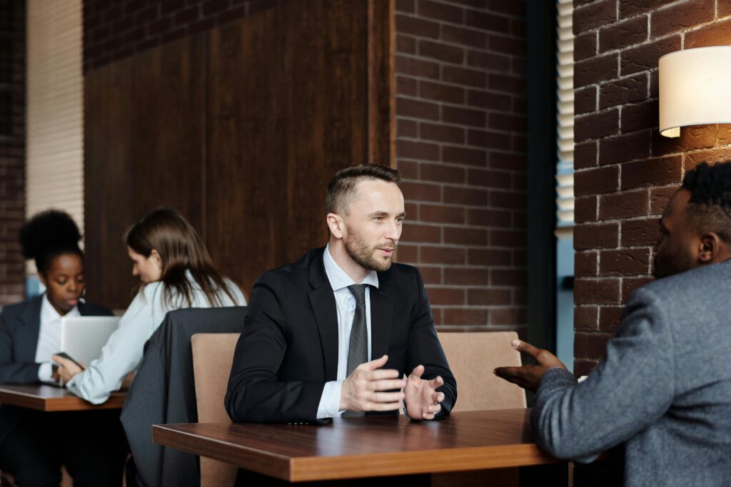 Two people talking in a cafe.