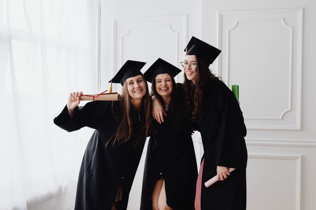 Women wearing graduation gowns.